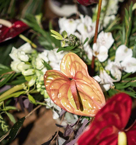 Tropical flower arrangement at Yema Kitchen, a Canggu venue for events, group dinners, birthdays, and private parties with elegant table styling.