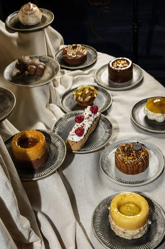 Assorted artisanal desserts on display at Yema Kitchen, a Mediterranean-inspired Canggu restaurant known for elevated sweets and handcrafted presentations.